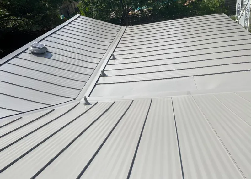 Solar attic fan installed on a metal roof for Roof Ventilation in Grand Island